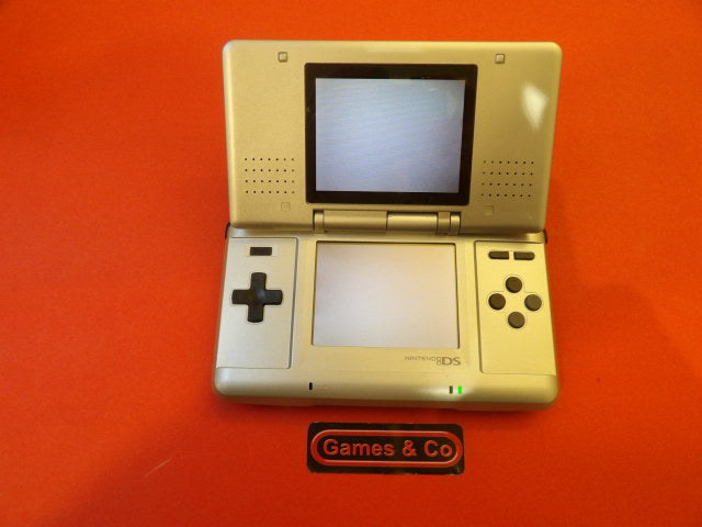 Nintendo DS console with charger displayed on a vibrant orange background.