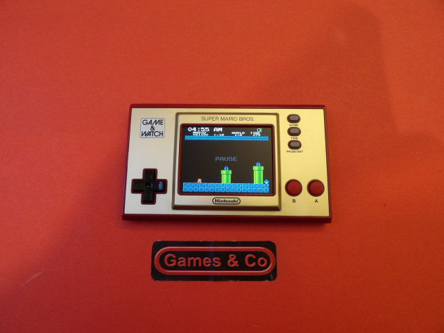 Nintendo Game & Watch Ball device showcasing Super Mario Bros gameplay on a vibrant color screen.