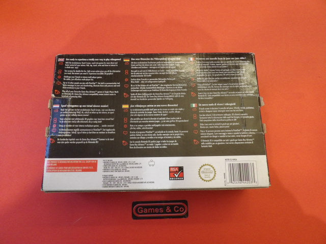 Nintendo DS console with charger in box back view showing product details and instructions.