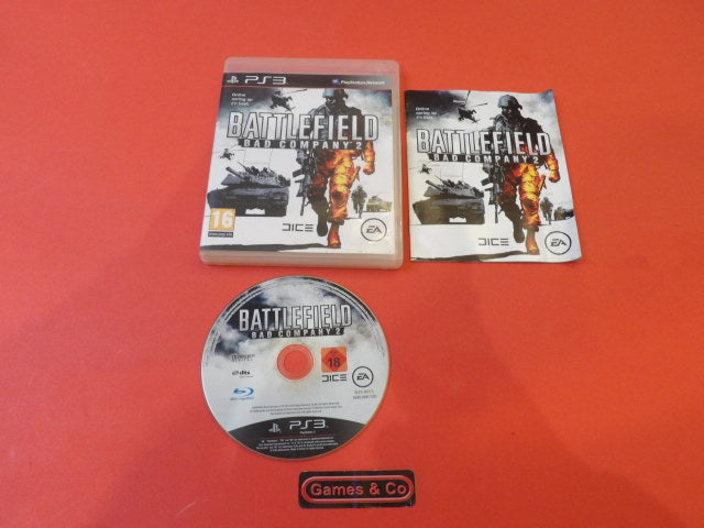 Battlefield Bad Company 2 PS3 disc with case and manual on a red background.