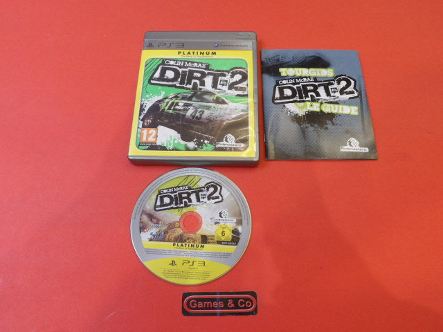 Colin McRae Dirt 2 PS3 disc with game cover and guide on an orange background.