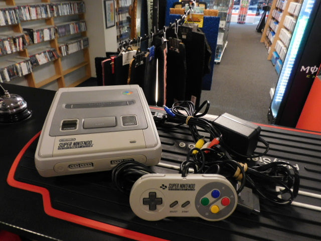 Used Super Nintendo console with controllers and cables ready for play.