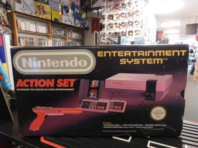 Nintendo NES Action Set console including controllers, light gun, and original packaging.