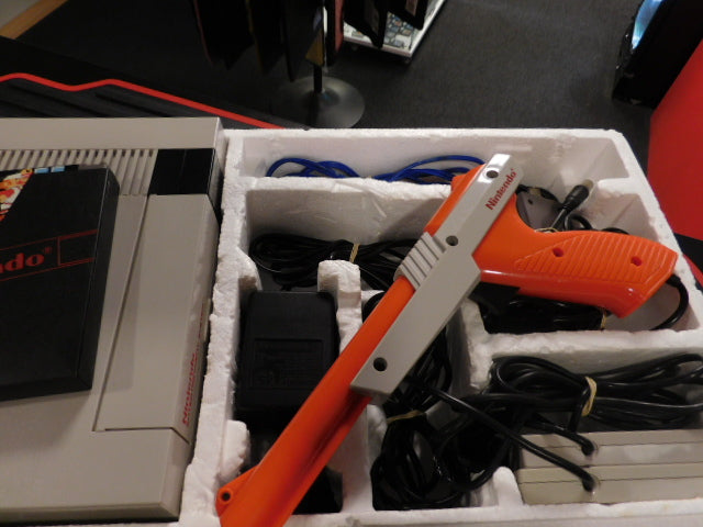 Nintendo NES Action Set console including controllers, cables, and accessories in original packaging.