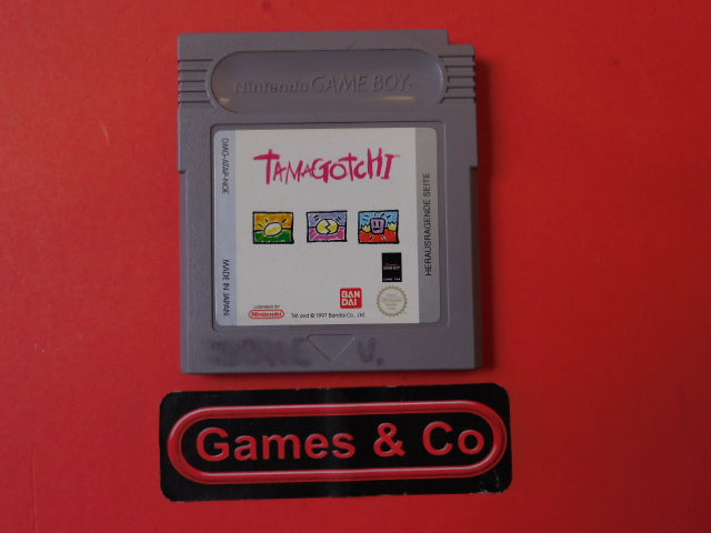 Tamagotchi Gameboy cartridge displayed with Game & Co branding on red background.