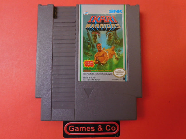 Ikari Warriors NES cartridge on a red background, showcasing the classic game cover art and design.