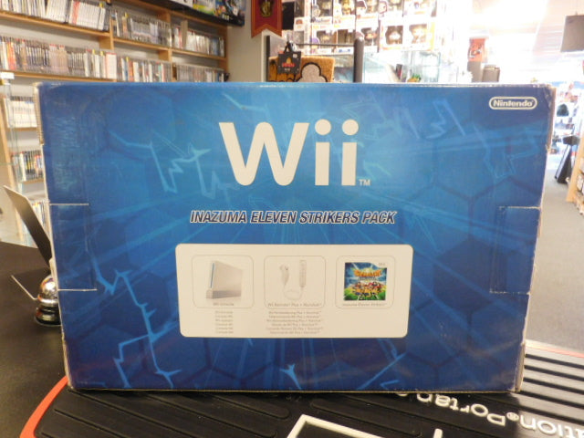 Wii Inazuma Eleven Strikers bundle showcased in packaging with accessories and game artwork.