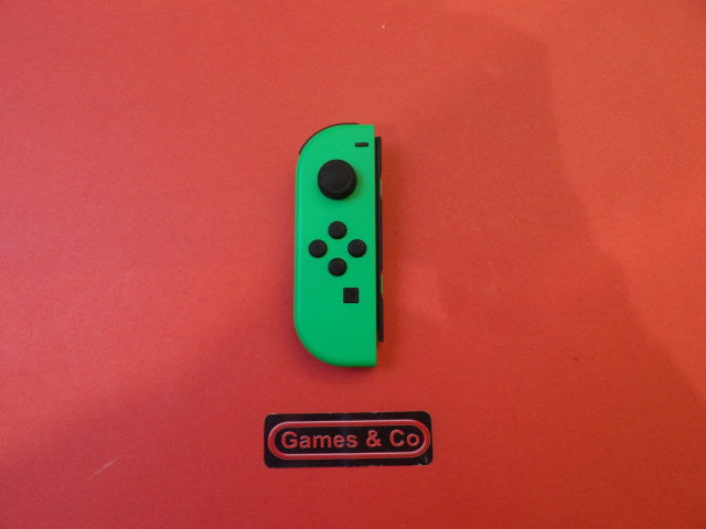 nintendo switch joy con links in vibrant green color on a red background.