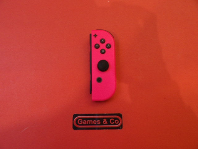 Used Nintendo Switch Joy-Con right controller in pink on a vibrant orange background.