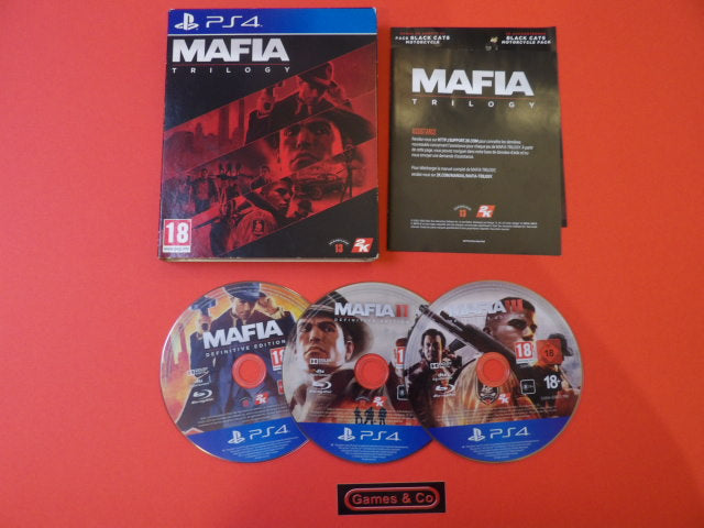 Mafia Trilogy PS4 game box and discs displayed on a red background with game information card.