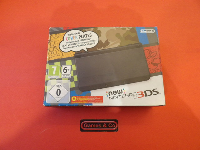 New Nintendo 3DS console with charger packaging showcasing replaceable cover plates