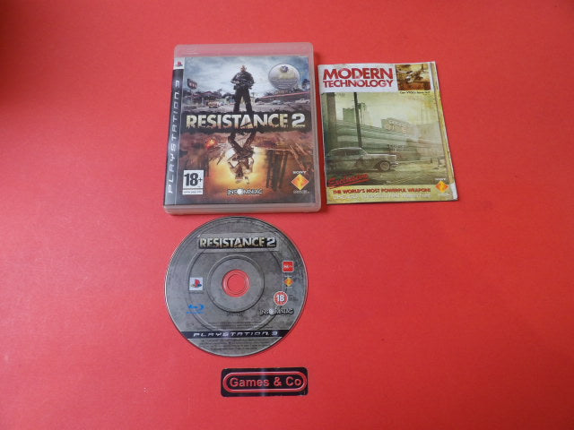 Playstation 3 Resistance 2 game disc and cover on a red background