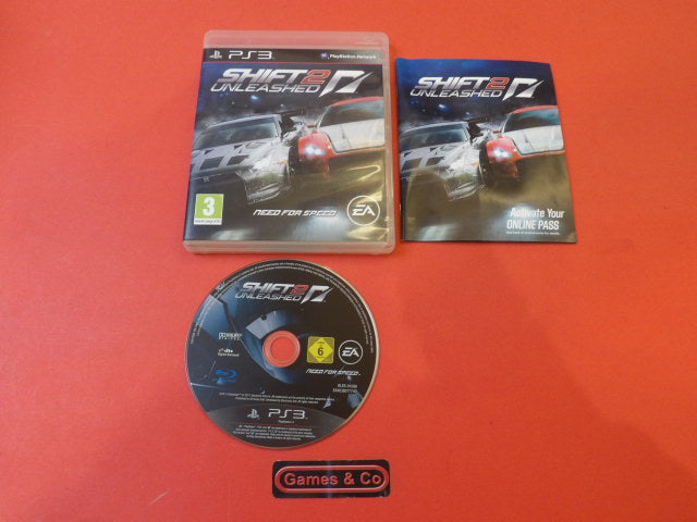 Playstation 3 Shift 2 Unleashed disc alongside the game cover and manual, showcasing the racing experience.