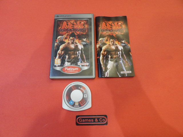 Tekken 6 PSP game case, disc and manual for Playstation PSP, featuring iconic characters and gameplay.