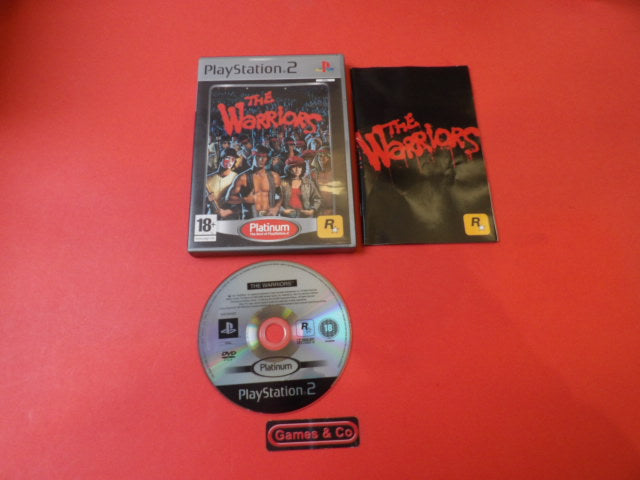 The Warriors Playstation 2 game disc and cover displayed on a red background, krasvrij condition.