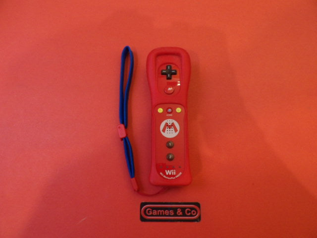 Wii remote + motion plus - Nintendo Wii, red controller with wrist strap and buttons.