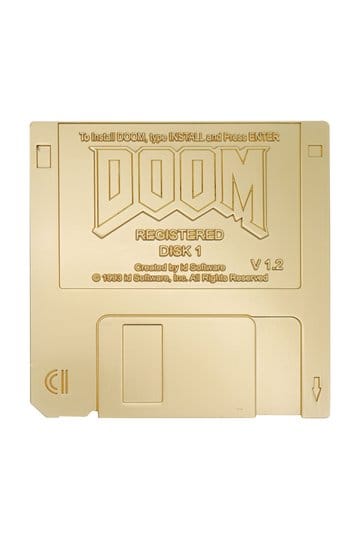 Limited edition Doom floppy disk replica in gold, featuring the iconic DOOM logo and registered details.
