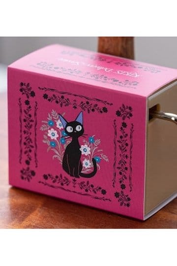 Kiki's Delivery Service music box featuring a black cat design with flowers on a pink background.
