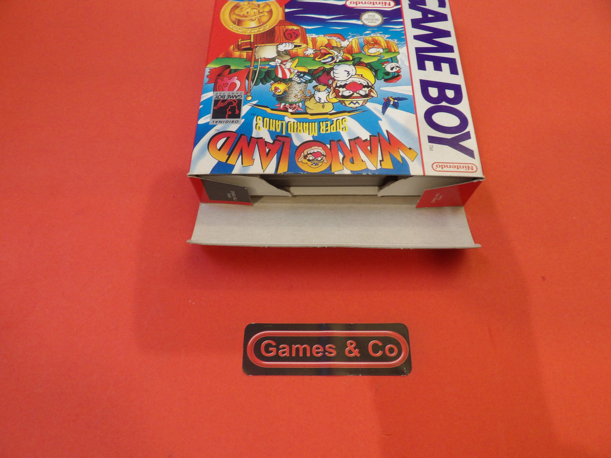 Image of the Game Boy Warioland game box on a red background, showcasing its classic design and branding.
