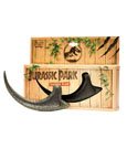 Jurassic Park Replica 1/1 Raptor Claw displayed on wooden box with Jurassic Park logo and foliage.